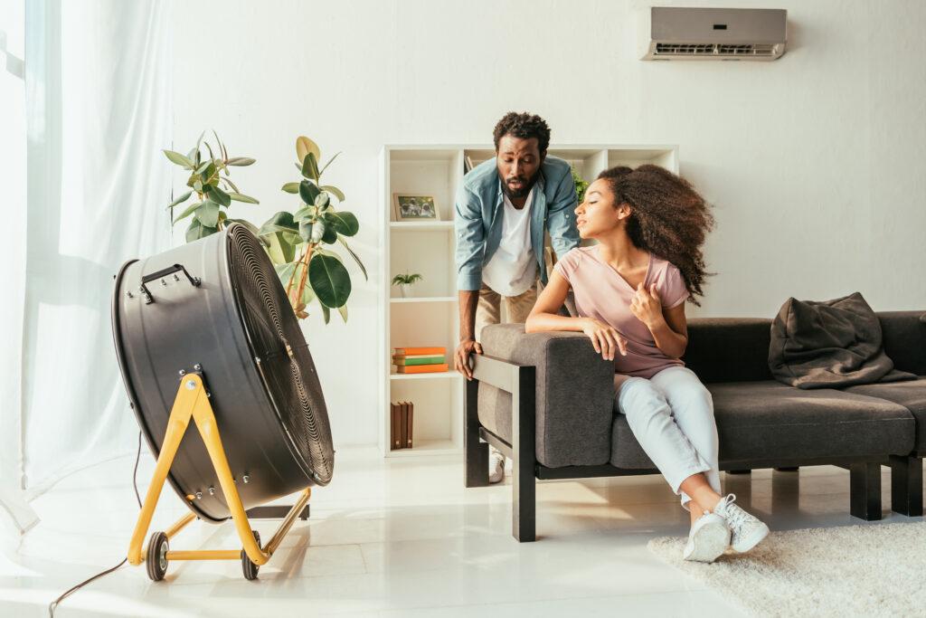 exhausted man and woman suffering from heat