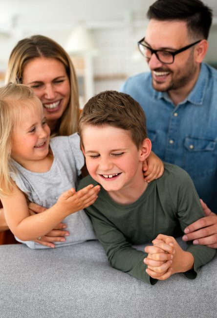 Happy family having fun and spending time together at home. Child parenting love concept
